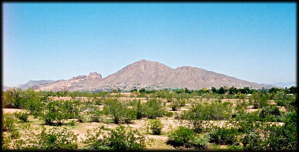 Camelback Mountain, one of the most recognizable Phoenix landmarks, as seen from Papago Park.  Sanctuary on Camelback, the Royal Palms Hotel, and the Phoenician are all located on the slopes of this peak.